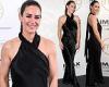 Kirsty Gallacher cuts a glamorous figure in a black halterneck jumpsuit