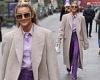 Ashley Roberts cuts a smart figure in a lilac shirt and purple trousers as she ...