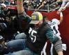 sport news Jalen Hurts dodges injury and falling Philadelphia Eagles fans as railing ...