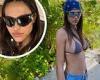 Amelia Hamlin shows off her ample cleavage and ripped abs in skimpy bikini top
