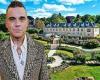 Robbie Williams FINALLY sells his £7million mansion after being forced to drop ...