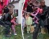Kanye West dotes on his daughter Chicago at her fourth birthday party as she ...