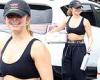 Addison Rae flashes her taut tummy and toned arms in black sports bra outside ...