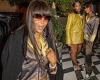Naomi Campbell shows off her impeccable sense of style in gold and brown satin ...