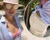 Vogue Williams shows off her baby bump in a pink bikini as the family holiday ...