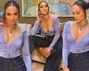 Jennifer Lopez models a low-cut top and as she puts her tiny 26in waistline on ...