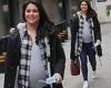 Pregnant Sam Quek shows of her blossoming baby bump in a tight grey T-shirt