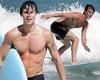 Shawn Mendes shows off his washboard abs as he surfs during his Hawaiian getaway