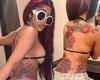 Cardi B showcases her huge back tattoos and side boob as she dons revealing ...
