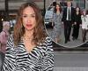 Myleene Klass looks typically chic in a zebra print dress as she steps out in ...