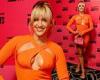 Ashley Roberts puts on a very busty display in an eye-catching orange cut out ...