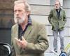 Hugh Laurie, 62, looks unrecognisable as he sports thick grey beard