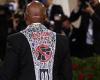 Eric Adams wears black tux with 'End Gun Violence' emblazoned on the back as he ...