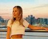Kate Ferdinand flashes her toned abs in a white crop-top as she poses for a ...