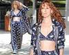 Rumer Willis shows off her toned tummy in a bra top with a matching coat