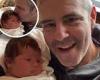 Andy Cohen cuddles and kisses his baby daughter Lucy as he promotes all new ...