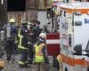 Two people are hospitalized while others are trapped after a building collapses ...