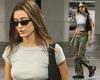 Hailey Bieber goes braless in a cropped tee and low-rise cargo pants while out ...