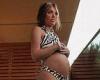 Charlotte Crosby shows off her baby bump in a zebra-print bikini