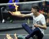 Protester enters court, sets his arm on fire during Laver Cup match