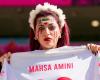 Fans cry, jeer Iranian anthem as players sing in World Cup clash against Wales