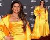 Priyanka Chopra dons a gold satin gown and matching floor-length coat trends now