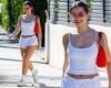 Addison Rae flashes her toned tummy in a crop top and low-rise shorts as she ... trends now