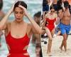 Cricket WAG Erin Holland sizzles in a red cut-out swimsuit on a beach trip with ... trends now