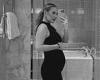 Kate Ferdinand displays her baby bump in a form-fitting black dress trends now