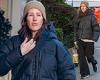 Ellie Goulding bundles up for the cold weather in a padded jacket as she runs ... trends now