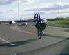 Heart-stopping moment motorcyclist falls off his bike while trying to do a ... trends now