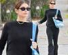 Kaia Gerber models an all black outfit as she RUNS to her yoga class trends now