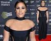 Alex Scott dons a corset-style black top with nude panels at London Football ... trends now