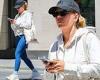 Scarlett Johansson dons skintight blue leggings and a baseball cap as she steps ... trends now