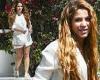 Shakira is the epitome of chic in an all-white ensemble with shorts while ... trends now