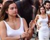 Addison Rae rocks a white maxi dress with cutouts above her hips on a date with ... trends now