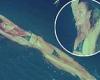 Candice Swanepoel dons a black string bikini as she swims gracefully to promote ... trends now