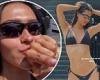Amelia Hamlin shows off her slender figure in a black bikini as she plays with ... trends now