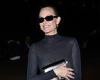 Amber Valletta, 50, playfully tries to cover her modesty as she goes braless in ... trends now