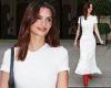 Emily Ratajkowski stuns in a bridal white gown and red leather boots as she ... trends now
