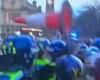 Shocking moment traffic cone is thrown at police as football fans clash with ... trends now