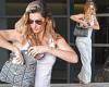 Gisele Bundchen keeps cool in a white tank top and lounge pants as she steps ... trends now