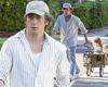Jeremy Allen White is a doting dad as he wheels his daughters Ezer, five, ... trends now