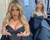 Bebe Rexha puts on a busty display in a denim black corset as she poses for ... trends now