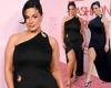 Ashley Graham flashes some leg in a black gown with a soaring split as she ... trends now
