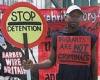 Failed asylum seeker, 40, who wore a sign saying 'migrants are not criminals' ... trends now