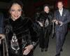 Joan Collins, 90, looks beautiful in a black fur cape as she leans on the arm ... trends now
