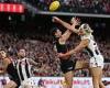sport news Anzac Day game ends in a DRAW in 28-year first after Essendon star Kyle ... trends now