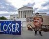 Anti-Trump protesters hold 'LOSER' signs outside the Supreme Court as justices ... trends now