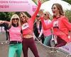 Trinny Woodall flashes her abs in a pink top as she throws her arms in the air ... trends now